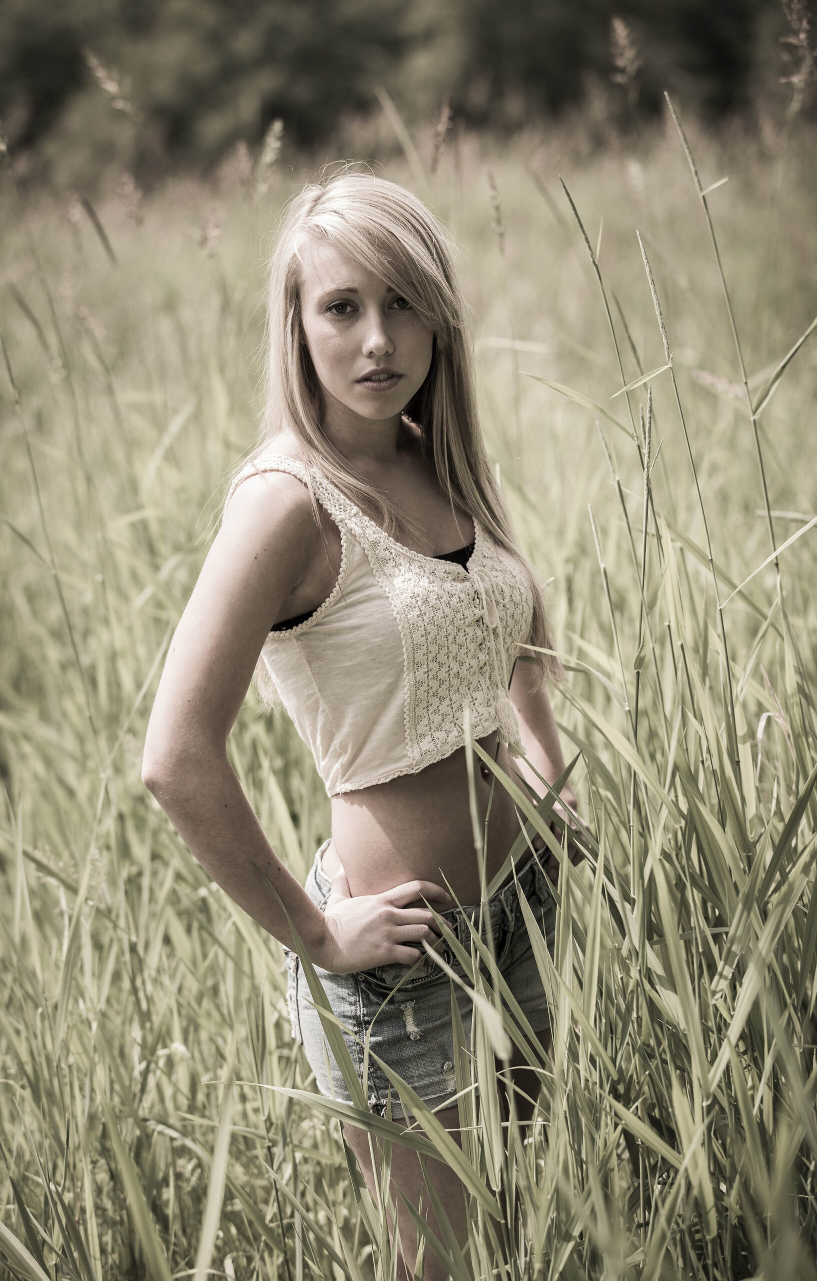 model posing in the field with grass
