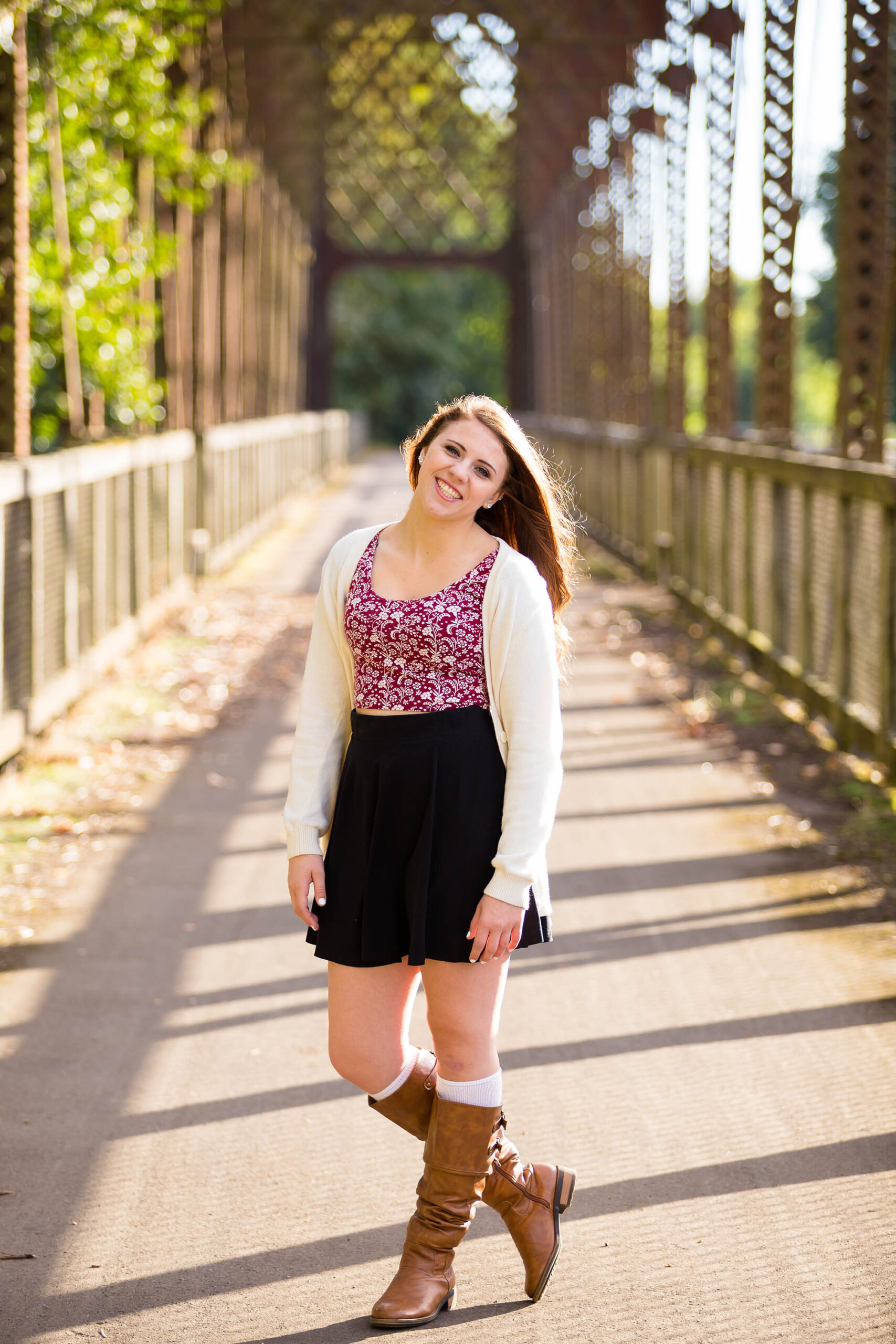 Teen girl poses for a high school senior portrait photo