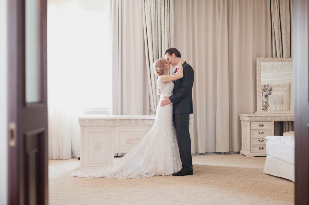 Pretty young couple in elegant wedding clothes 