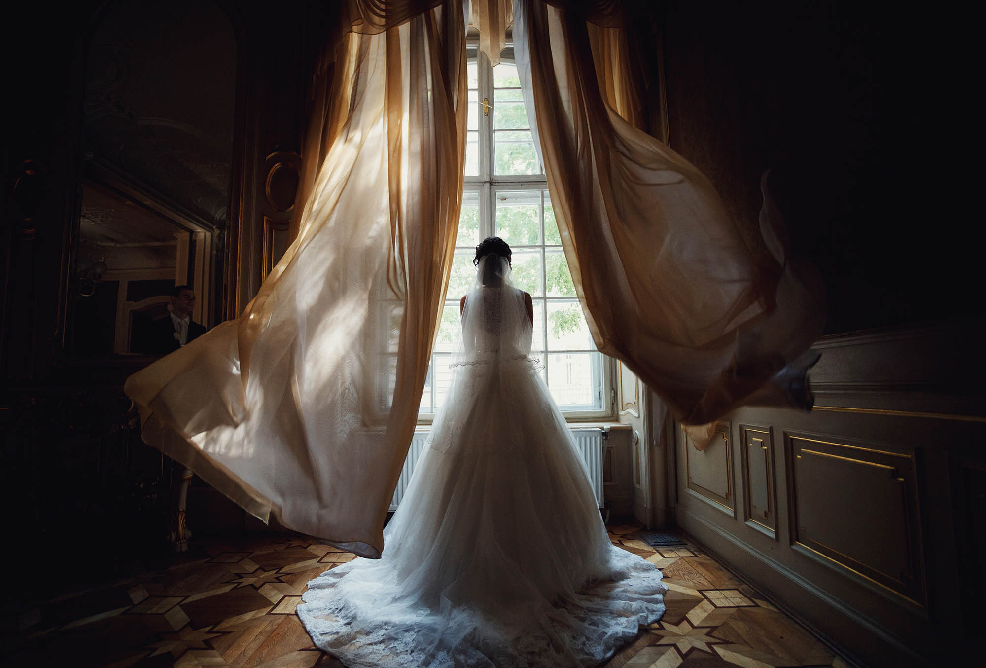 Amazing photo of the bride next to the window