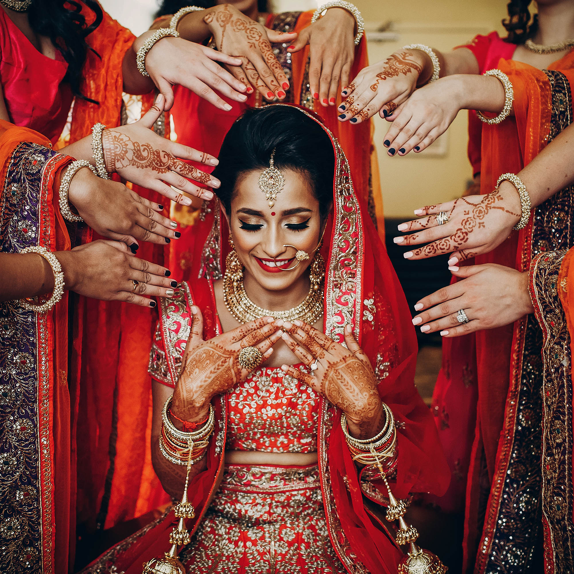 Stunning Indian bride dressed in Hindu traditional wedding clothes lehenga photo