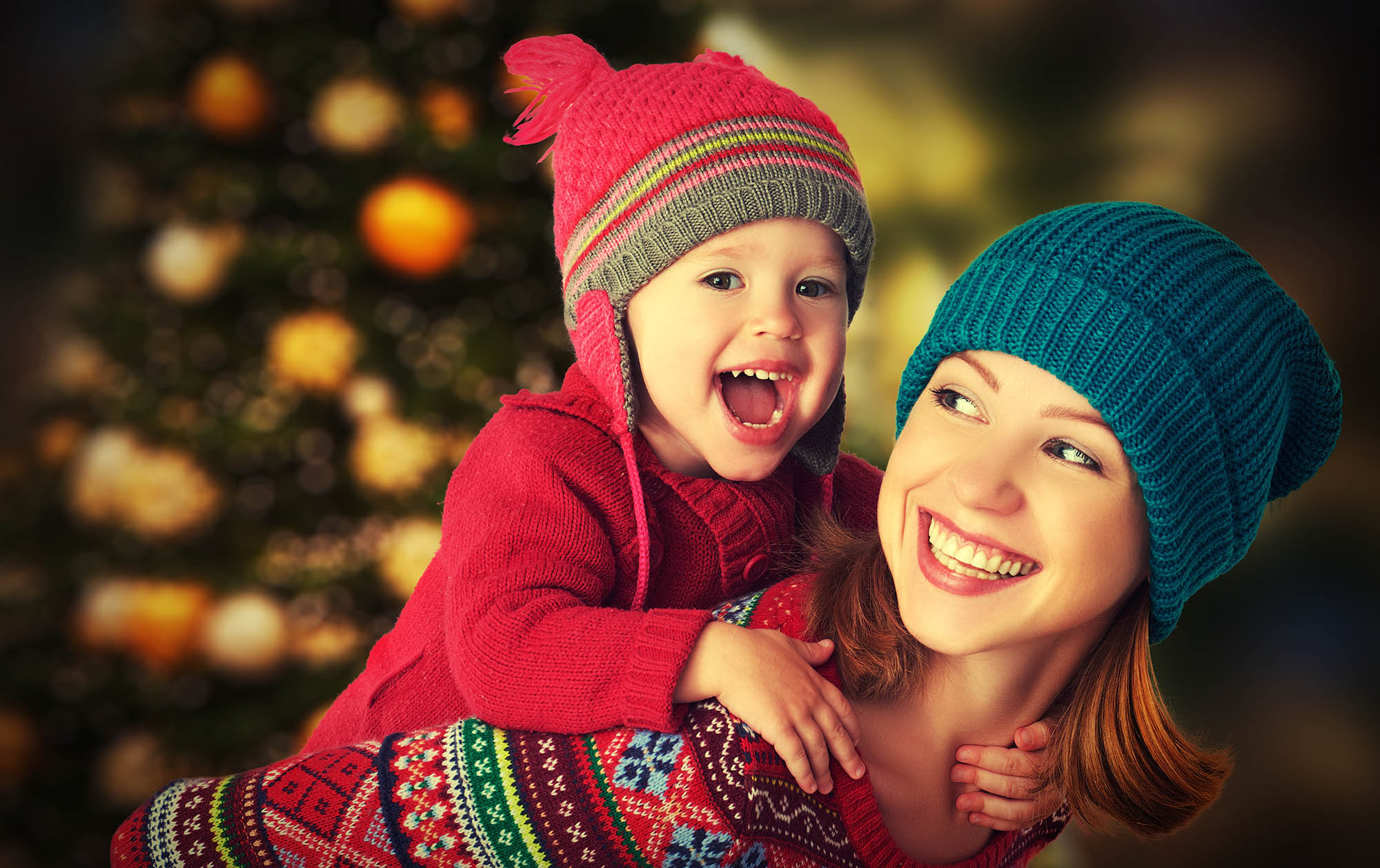 Happy,Family,Mother,And,Baby,Little,Daughter,Playing,In,The happy family mother and baby little daughter playing in the winter for the Christmas holidays